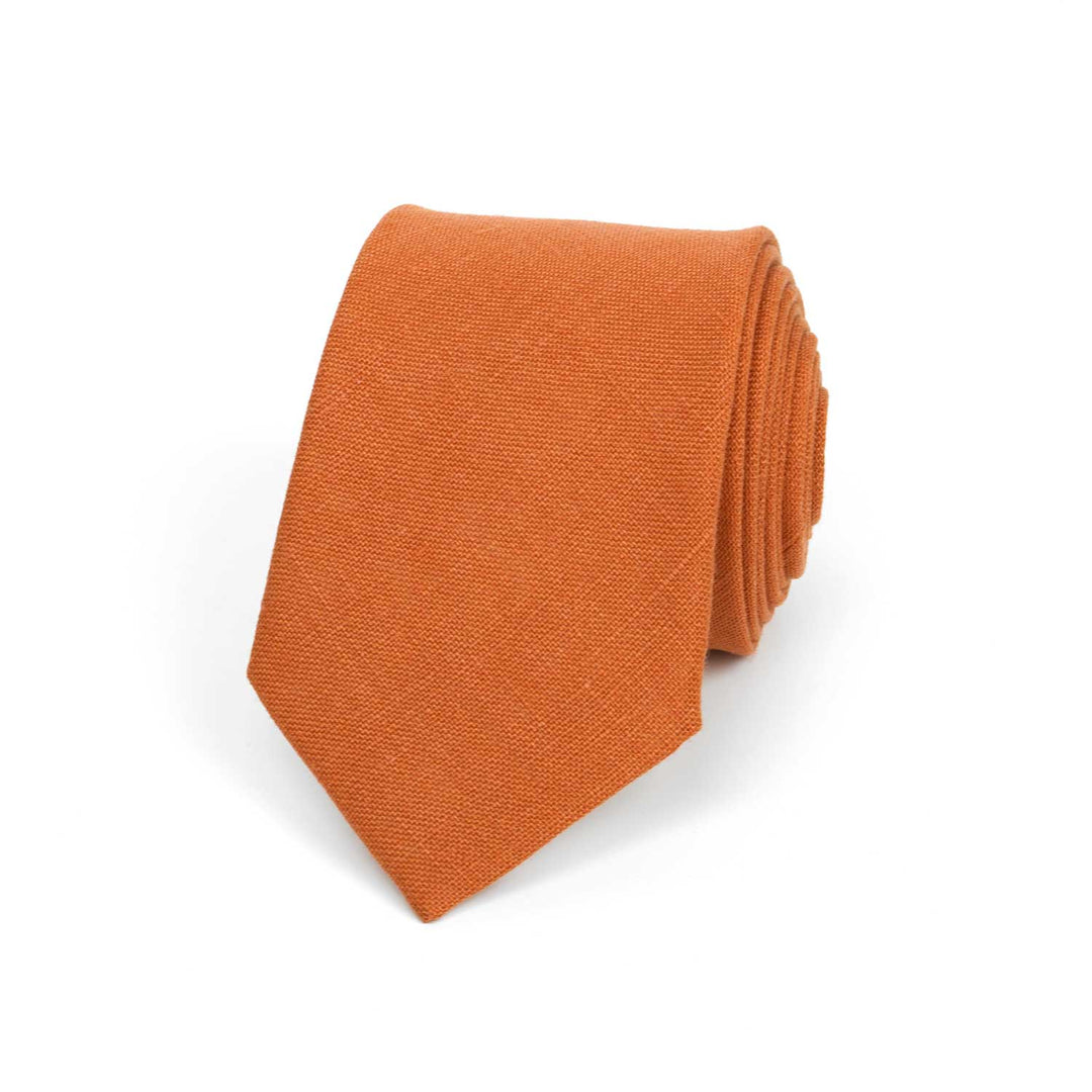 Front view of a burnt orange linen necktie with a matte textured finish, isolated on a white background.