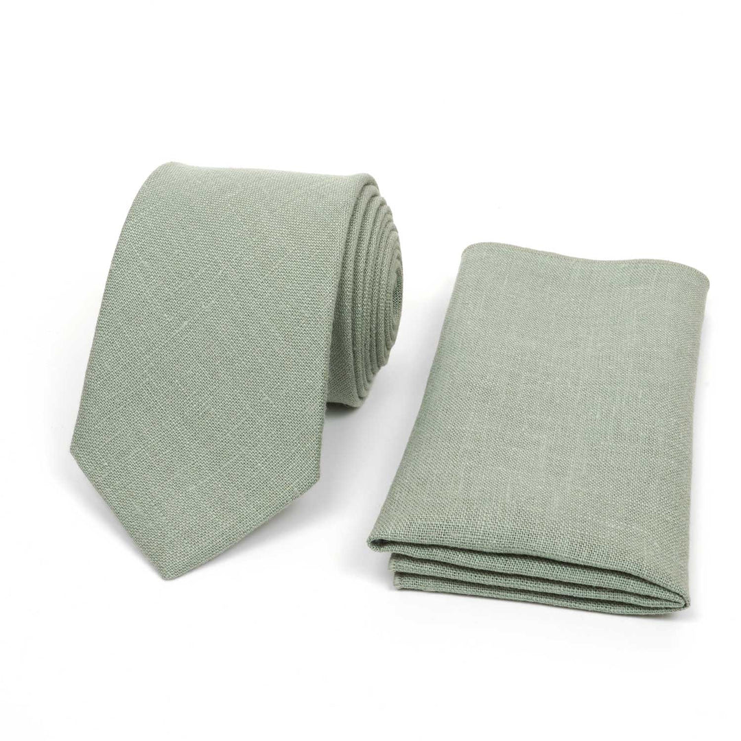 Light sage green linen necktie and matching pocket square set, handmade for weddings, displayed on a white background.