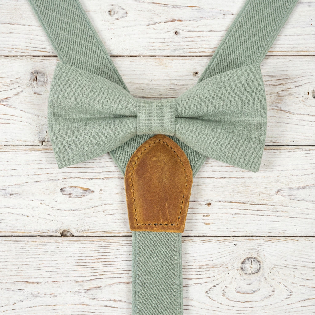Zoomed-in view of light sage green suspenders and matching bow tie set