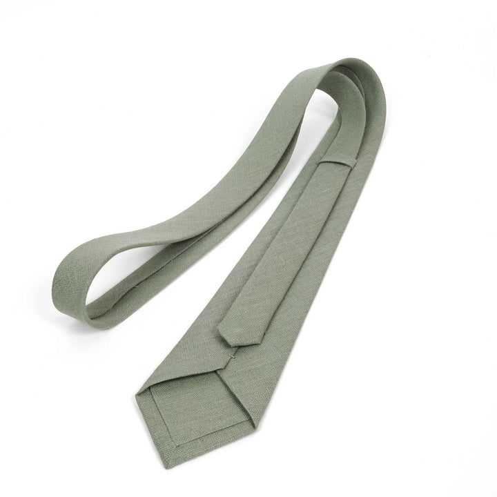 Full back view of a sage green necktie showing the keeper loop and tipping, displayed on a white background.